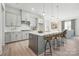 Modern kitchen with island, white cabinets, and stainless steel appliances at 7108 Wayfarer Dr # 0082, Charlotte, NC 28269