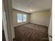Spacious carpeted bedroom with two large windows at 111 Sweetwater Dr, Statesville, NC 28625