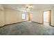 Large bedroom with plush carpeting and spacious closet at 24686 Barbees Grove Rd, Oakboro, NC 28129