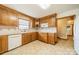 Kitchen boasts ample wood cabinets, tile flooring and modern appliances at 24686 Barbees Grove Rd, Oakboro, NC 28129