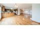 Eat-in kitchen with wood cabinets, tiled floors and access to living areas at 24686 Barbees Grove Rd, Oakboro, NC 28129