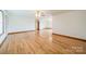 Spacious living room featuring hardwood floors and lots of natural light at 24686 Barbees Grove Rd, Oakboro, NC 28129