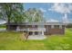 Brick ranch house back, deck, patio, and large yard at 24686 Barbees Grove Rd, Oakboro, NC 28129