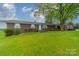 Brick ranch house, large yard, mature tree, front view at 24686 Barbees Grove Rd, Oakboro, NC 28129