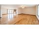 Bright living room with hardwood floors and access to kitchen and dining areas at 24686 Barbees Grove Rd, Oakboro, NC 28129