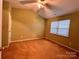 Bedroom with vaulted ceiling and carpet at 10875 Holly Ridge Blvd, Charlotte, NC 28216