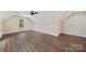 Spacious bedroom with wood-look floors, ceiling fan, and window at 113 Spring Forest Dr, Shelby, NC 28152