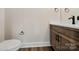 Modern powder room with wood vanity and white countertop at 113 Spring Forest Dr, Shelby, NC 28152