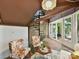 Sunroom with spiral staircase, brick wall, and lake views at 1665 Bowater Rd, Rock Hill, SC 29732