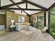 Bright living room with vaulted ceiling, large windows, and wooded views at 1665 Bowater Rd, Rock Hill, SC 29732