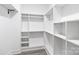 Large walk-in pantry with ample shelving for storage at 11601 Cresthill Dr, Mint Hill, NC 28227