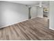 Living room with wood-look floors, offering an open floor plan at 3021 Heathstead Pl # D, Charlotte, NC 28210