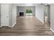 Open living room with fireplace and sliding glass doors to balcony at 3021 Heathstead Pl # D, Charlotte, NC 28210