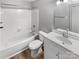 Updated bathroom with a toilet, sink, and shower/tub combo at 3021 Heathstead Pl # D, Charlotte, NC 28210