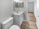 Clean bathroom with a vanity, toilet and bathtub at 3021 Heathstead Pl # D, Charlotte, NC 28210