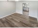 Bright dining area with wood-look floors and open view to kitchen at 3021 Heathstead Pl # D, Charlotte, NC 28210