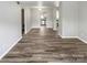 Spacious living area with hardwood floors and views into the kitchen at 3021 Heathstead Pl # D, Charlotte, NC 28210