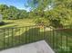 Private patio with a view of a grassy backyard and lush trees at 3021 Heathstead Pl # D, Charlotte, NC 28210