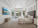 Spacious main bedroom features a large bed, sitting area, and stunning views at 9044 Island Point Rd, Charlotte, NC 28278