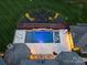 Aerial view of a luxurious pool and patio with water features at 9044 Island Point Rd, Charlotte, NC 28278