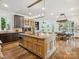 Large kitchen with island, stainless steel appliances, and breakfast area at 9044 Island Point Rd, Charlotte, NC 28278