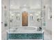 Luxurious bathroom with a large soaking tub and double vanities at 9044 Island Point Rd, Charlotte, NC 28278