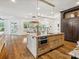 Large kitchen island with granite countertops and stainless steel appliances at 9044 Island Point Rd, Charlotte, NC 28278