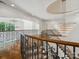 Impressive staircase with ornate railing and crystal chandelier at 9044 Island Point Rd, Charlotte, NC 28278
