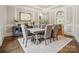 Formal dining room with a large table, neutral decor and hardwood floors at 9044 Island Point Rd, Charlotte, NC 28278
