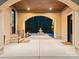 Elegant entryway with arched doorways leading to a courtyard fountain at 9044 Island Point Rd, Charlotte, NC 28278