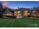 Luxury home with manicured lawn, and a beautiful wooded setting at 9044 Island Point Rd, Charlotte, NC 28278