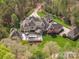 Luxury home with large backyard, pool, and multiple garages at 9044 Island Point Rd, Charlotte, NC 28278