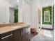 Spa-like bathroom with walk-in shower, soaking tub, and modern vanity at 9044 Island Point Rd, Charlotte, NC 28278
