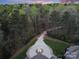 Long driveway leading to home through wooded area at 9044 Island Point Rd, Charlotte, NC 28278