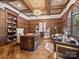 Elegant home office boasts wood paneling, built-in shelves, and a large desk at 9044 Island Point Rd, Charlotte, NC 28278