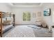Bedroom with bunk beds, large window, and comfortable seating at 9044 Island Point Rd, Charlotte, NC 28278