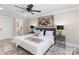 Spacious bedroom with a large bed, artwork, and ensuite bathroom access at 19627 Smith Cir, Cornelius, NC 28031