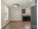 Eat-in kitchen with dark brown cabinets, stainless steel appliances, and wood-look flooring at 159 Badin Lake Cir, New London, NC 28127