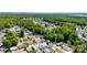 Aerial view of a lakefront community with lush greenery at 159 Badin Lake Cir, New London, NC 28127