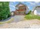 Two-story home with wooden deck and a nicely landscaped yard at 159 Badin Lake Cir, New London, NC 28127