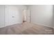 Carpeted bedroom with double doors and access to hallway at 609 Cashion Rd, York, SC 29745