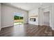 Living room with fireplace, hardwood floors, and sliding glass doors at 609 Cashion Rd, York, SC 29745