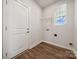 Laundry room with shelving, window, and vinyl flooring at 609 Cashion Rd, York, SC 29745
