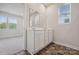 Double vanity bathroom with a mirror and brown tile floor at 609 Cashion Rd, York, SC 29745