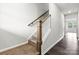 Elegant staircase with wooden railing and carpet runner at 634 Cashion Rd, York, SC 29745