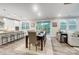 Open concept dining area with table and chairs, adjacent to kitchen and living room at 9839 Quercus Ln, Huntersville, NC 28078