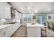 Modern kitchen with white cabinets, stainless steel appliances, and an island at 9839 Quercus Ln, Huntersville, NC 28078