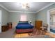 Bedroom with a double bed, dresser, and en-suite bathroom at 119 E May St, New London, NC 28127