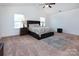 Spacious primary bedroom with carpeted floors and ample natural light at 6822 Broad Valley Ct, Charlotte, NC 28216