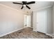 Spacious bedroom with ceiling fan and hardwood floors at 122 River Ridge Ln, Hickory, NC 28601